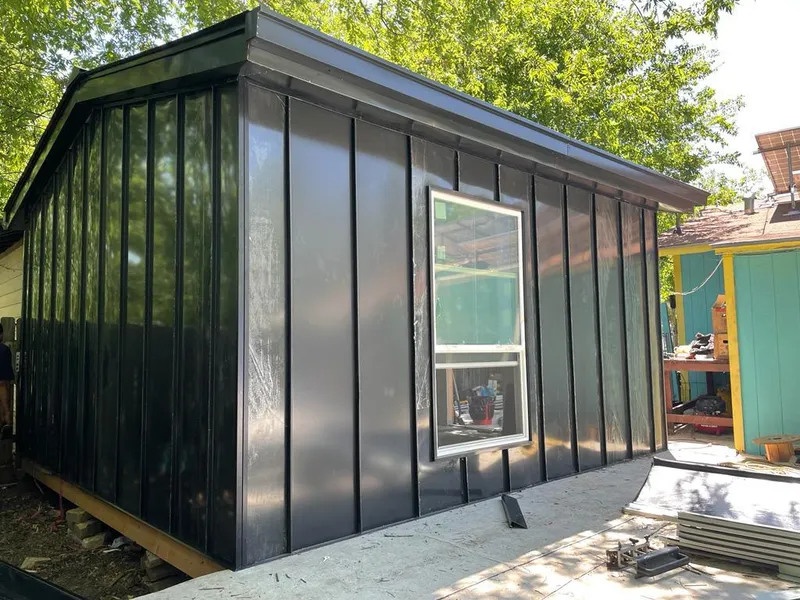 Black standing seam metal wall panels for Roof Inspection in Snyder